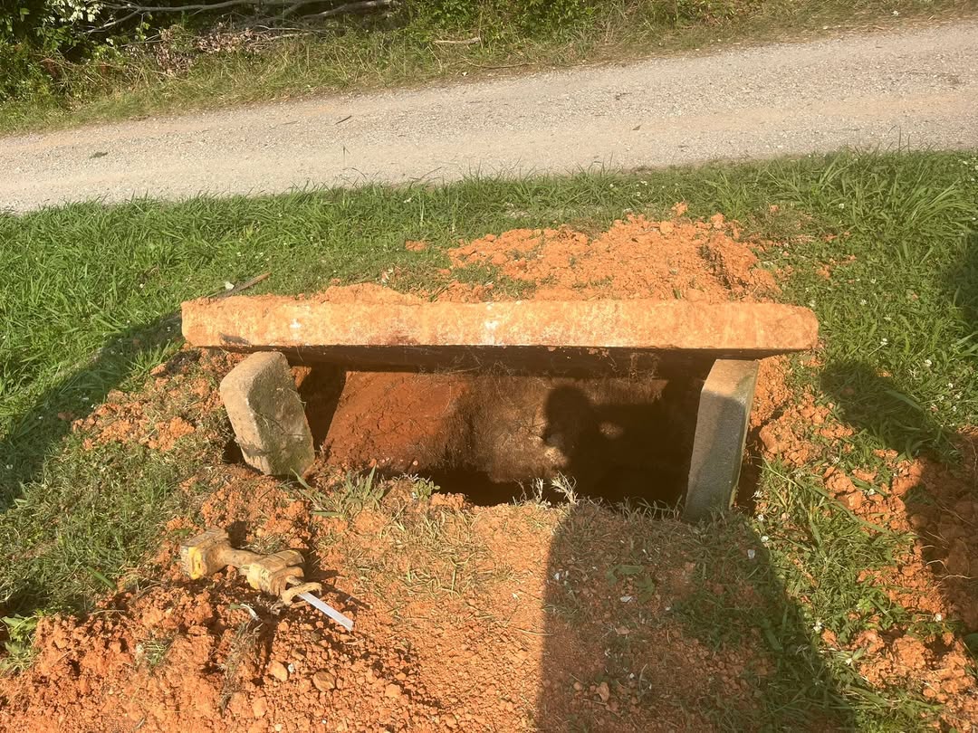 Open septic tank lid during an inspection in Union County
